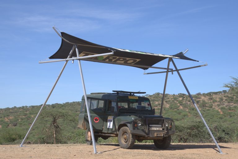 Wave tensile car shades 3 Tensile shade over a 4x4 in the open