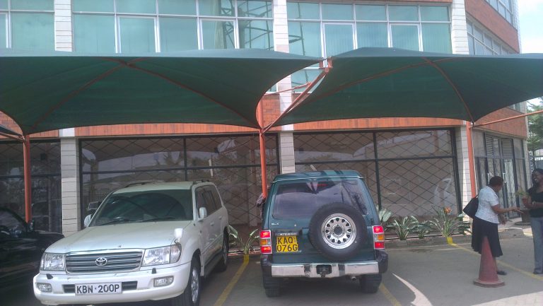 Cantilever car shade over SUVs